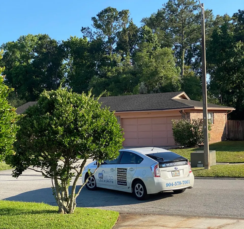 Marked WDJ Locksmith vehicle parked in the driveway of a Jacksonville home