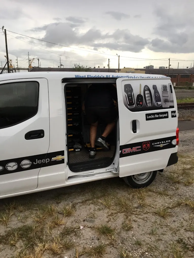 Technician working inside a marked van on a service call